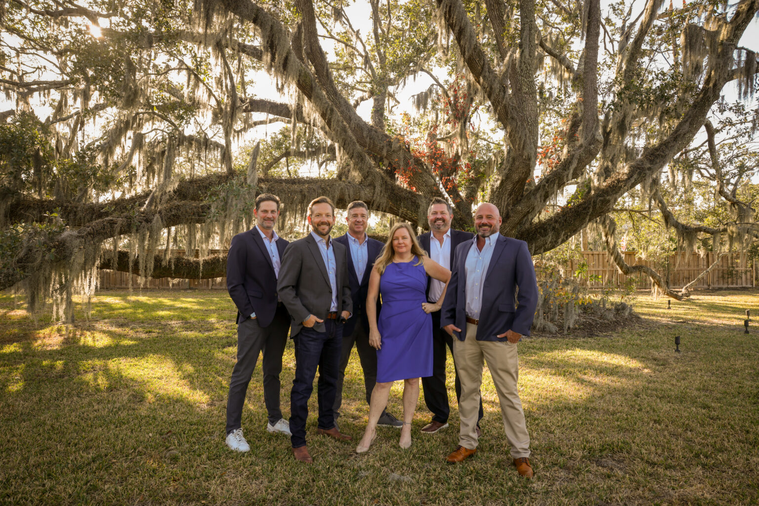 The Local Team at CMG Home Loans standing together under a live oak tree